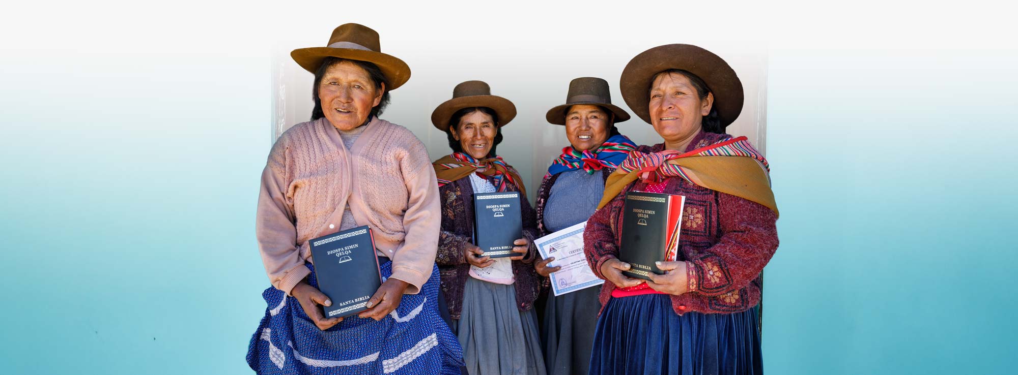 Americas four women holding new Bible