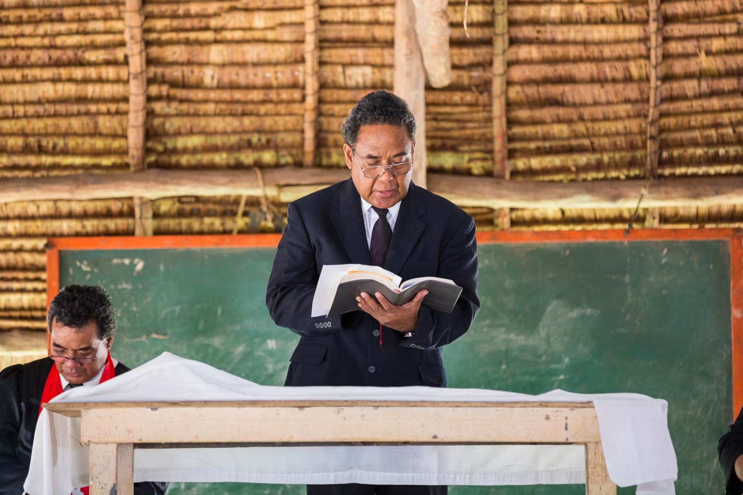 Pastor reads scripture