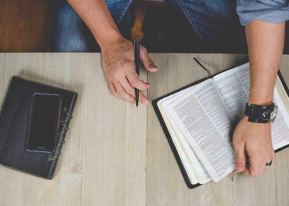 Person studying Bible.