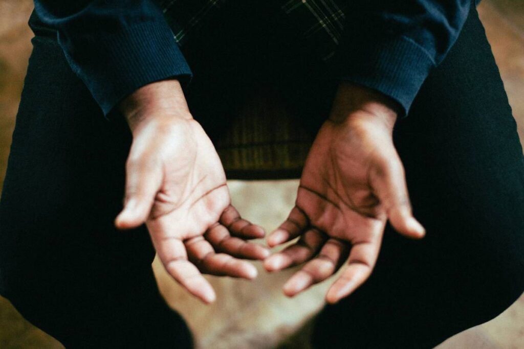 Image taken of open hands from above.